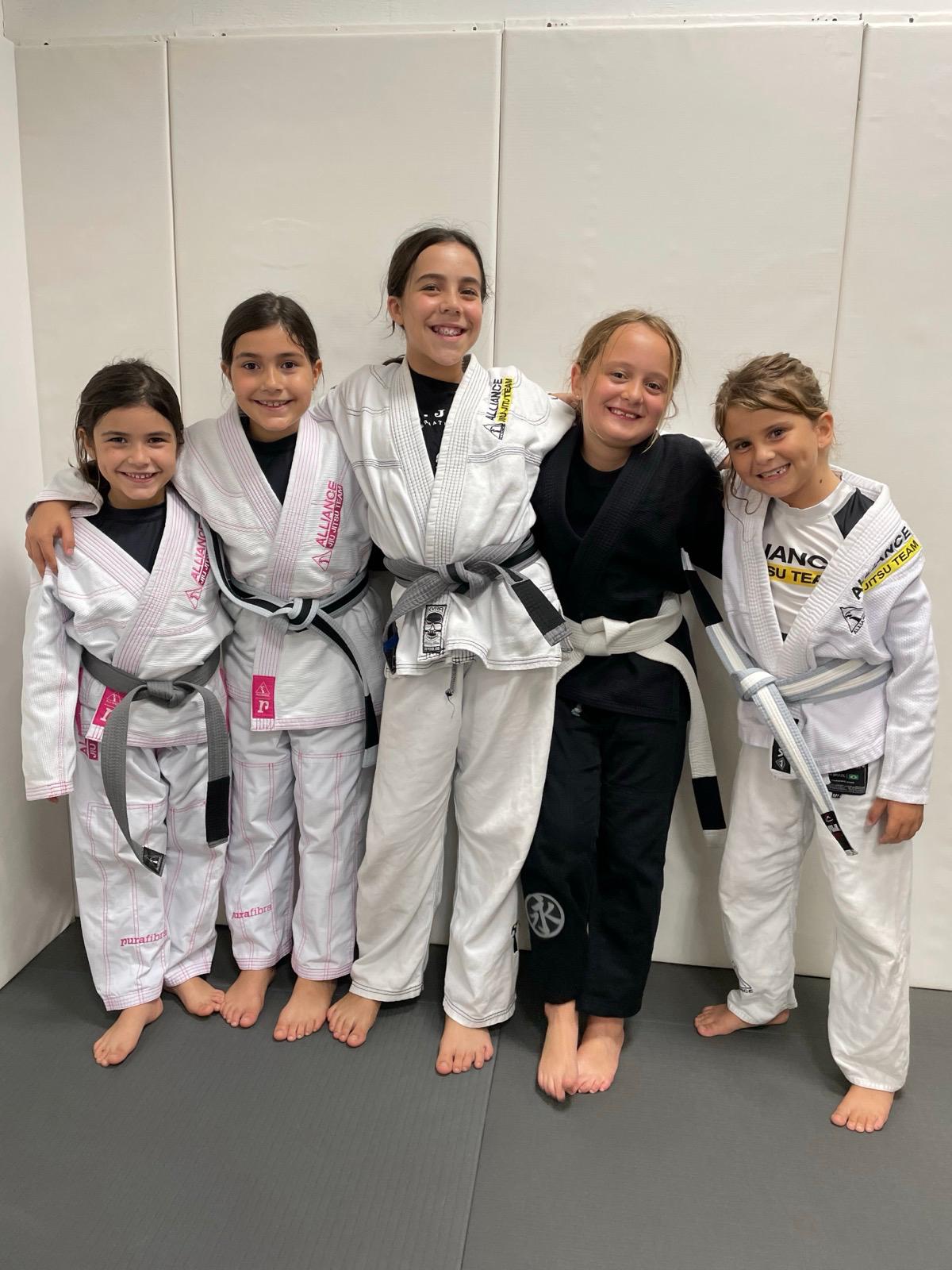 Group of young girls in Alliance gis after class